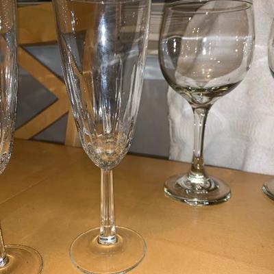 Assortment of Items Wine Glasses Teacup And Saucer