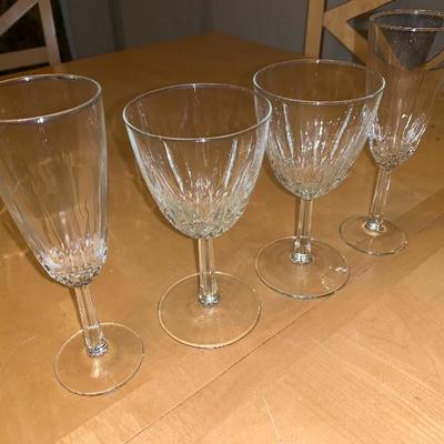 Assortment of Items Wine Glasses Teacup And Saucer