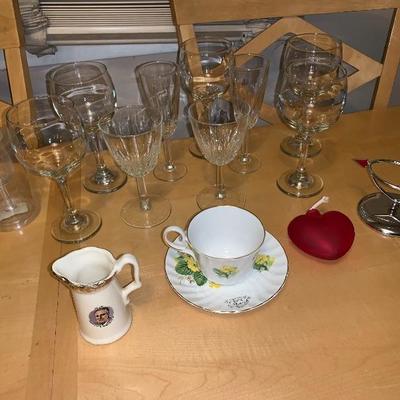 Assortment of Items Wine Glasses Teacup And Saucer