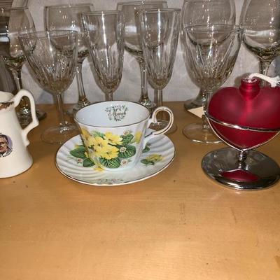 Assortment of Items Wine Glasses Teacup And Saucer