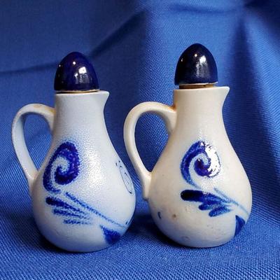 Lot 100: Pr. Small salt Glaze Stoneware cruets $15
