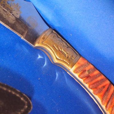 Engraved sheath knife with sheath