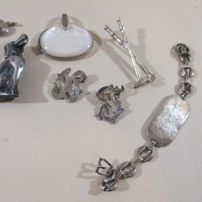 A lot of sterling mixed jewelry  pendant, bracelet, golf pin initial brooch 56.1 gram