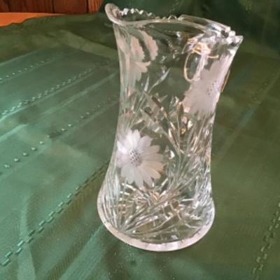 #k67. Saw tooth cut crystal pitcher and two glasses