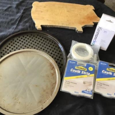 #gar42. Tub and wall clock, two pizza pans, kenmore filter and pig cutting board