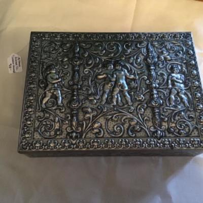 #fr4.  Vintage cherub embossed tin from western Germany