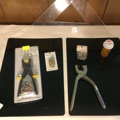#p10.  Two eyelet pliers, supplies, two black metal sheets