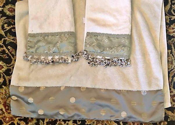 white towels with green trim