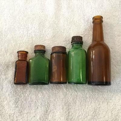 Antique green and brown medicine bottles 