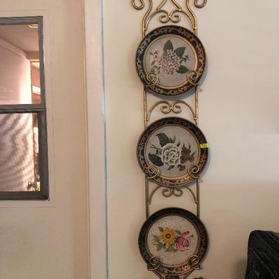 Decorative plates on hanging plate holder 