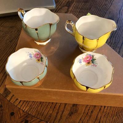 2 sets of cream and sugar