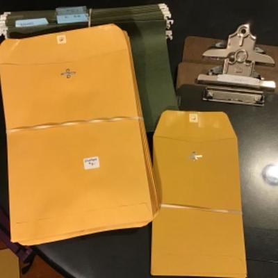 #DBR-43.  Three clipboards, envelopes, and hanging holders