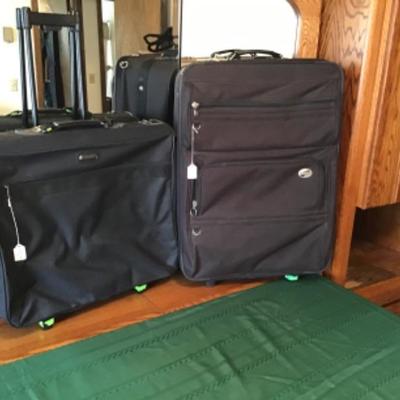 #gb57.  Rolling garment bag and 28 x 20 rolling suitcase