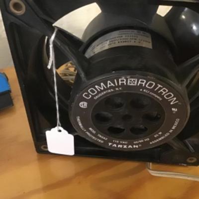 #a9.  Folding table and contents on top, including Comair Rotron motor