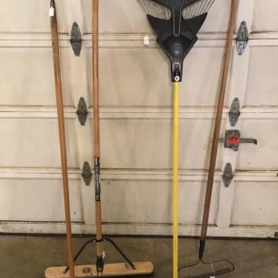 #a65.  Two rakes, broom and hoe