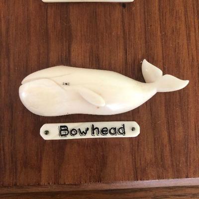 Aletha Macy Hand Carved Whale Figurines on Mahogany 