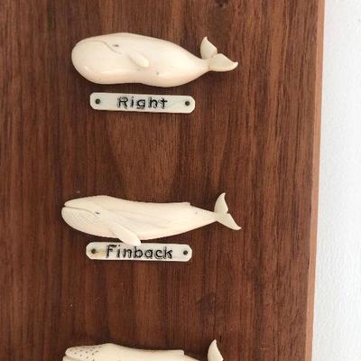 Aletha Macy Hand Carved Whale Figurines on Mahogany 