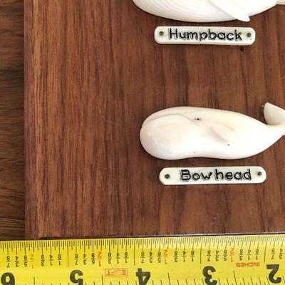 Aletha Macy Hand Carved Whale Figurines on Mahogany 
