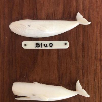 Aletha Macy Hand Carved Whale Figurines on Mahogany 
