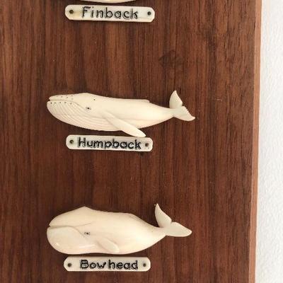 Aletha Macy Hand Carved Whale Figurines on Mahogany 