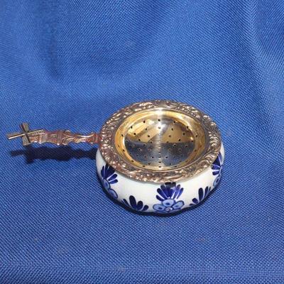 Lot 245: Delft windmill tea strainer with under bowl  $15