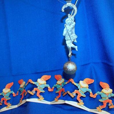 Lot248: Balancing Tin Santa Candleholder and Swedish Gnome Garland   $20