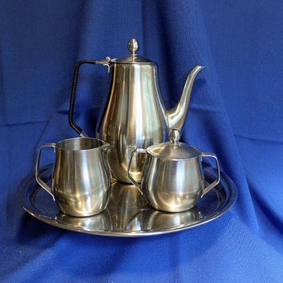 Lot 219: Reed and Barton Stainless Tea set  $20