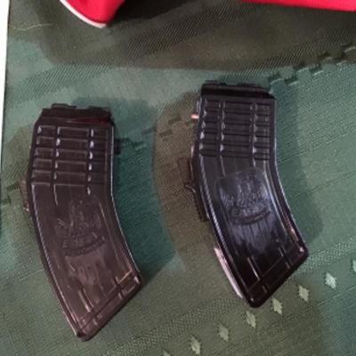 #a102.  Red case, tru glow light, two Eagle ammo clips (for air soft??)