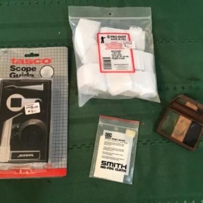 #a104.  Tasco scope guide, face paint, gun cleaning rags