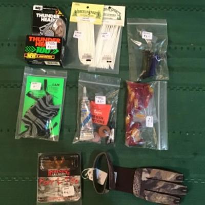 #a132. Two broadheads, pull  glove, vanes  and miscellaneous