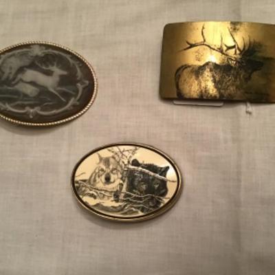 #z1.  Three wildlife belt buckles