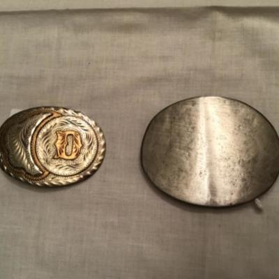 #z3.  Two silver belt buckles