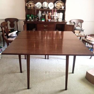 Drop leaf kitchen dining table. Both sides go down with chairs priced separately. Table $175.00 Chairs 6 for $150. Table size 46