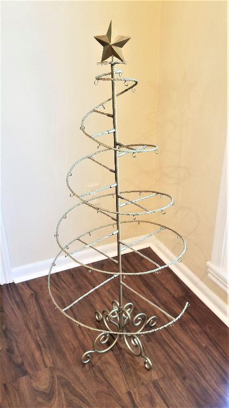 Lot #18 Metal Christmas Tree  holds 40 ornaments.  EstateSales.org