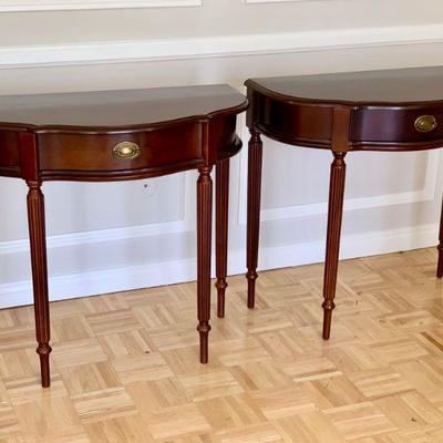 LOT 27 Pair of demi-lune side tables