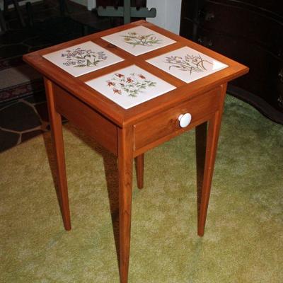 Lot 434: Tile top table with drawer