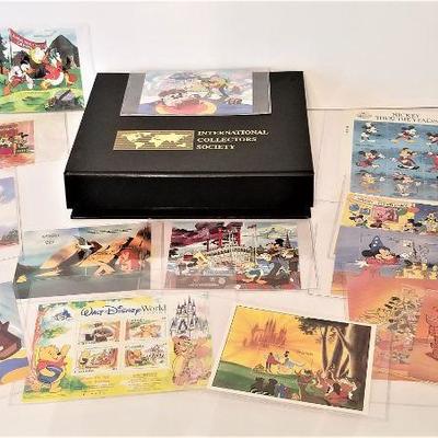 Lot #75  14 Packets of Collectible Disney Postage Stamps (unused) with COA's and box