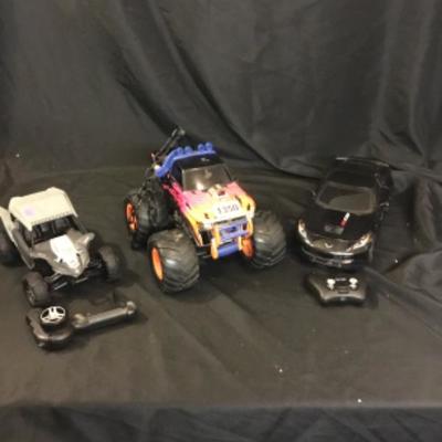 Three RC cars two with remotes, unsure if work lot number 1350