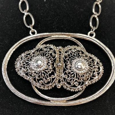 Large statement piece necklace silver tone looks like owls face