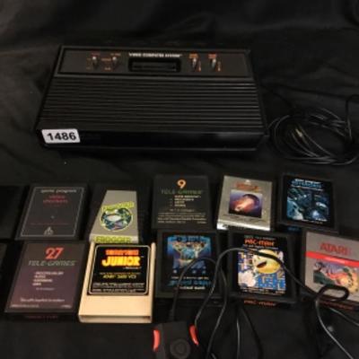 Atari 2600 w/12 games and controller Lot 1486