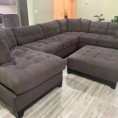 Grey Sectional Suede with Ottoman   3pc sectional left large piece 42x104, middle piece 60