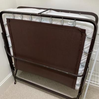 Lot #104 Fold away Cot with bedding