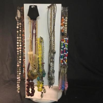 Assorted costume jewelry, necklaces, bracelets, keychains Lot 1511 does not include display