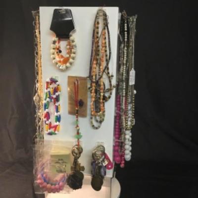 Assorted costume jewelry, necklaces, bracelets, keychains Lot 1511 does not include display