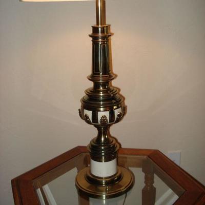 2 glass top end tables, 1 lamp and a swivel rocking chair