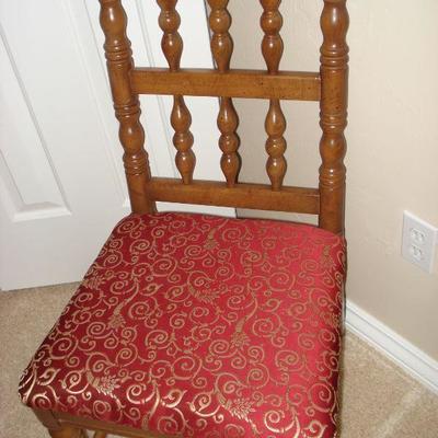 Wooden chair with red seat
