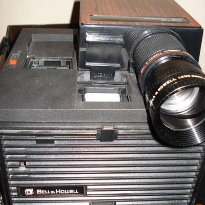Vintage camcorder, tripod and slide projector Bell & Howell