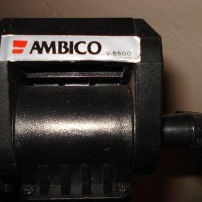 Vintage camcorder, tripod and slide projector Bell & Howell