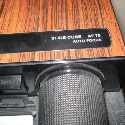 Vintage camcorder, tripod and slide projector Bell & Howell