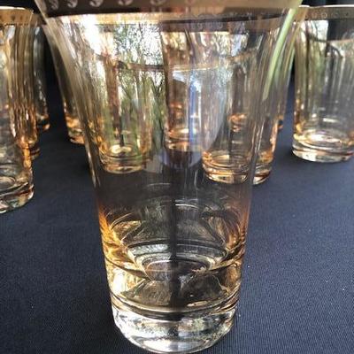 Set of 12 Gold iridescent Glasses with Gilt Trim.